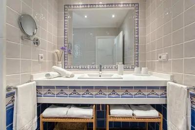 a bathroom with a sink and a mirror at Lux Villa with Heating Pool, Air Conditioning, Starlink & BBQ near Cullera Beach in Llaurí