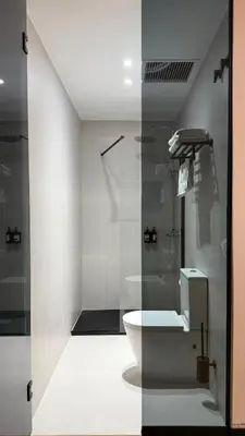 a bathroom with a shower and a toilet and a sink at ITOUR Hotel & Coffee in Museros