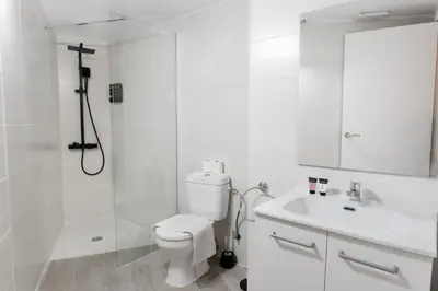 a bathroom with a shower and a toilet and a sink at GuestReady - Bright home in Valencia in Valencia