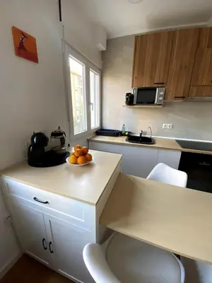 a kitchen with a bowl of fruit on a counter at Bright & Quiet Apartment Close to Central Valencia in Valencia