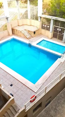 an overhead view of a swimming pool with blue water at Van-Dyck, ESC-4, 6-24 PK 18 in Cullera