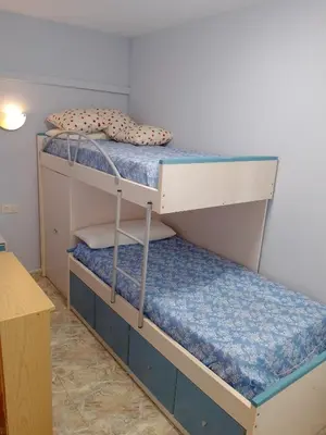 two bunk beds in a room with a table at Van-Dyck, ESC-4, 6-24 PK 18 in Cullera