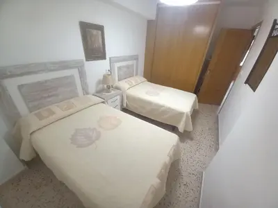 a hotel room with two beds with flowers on them at Sol, 3-20 in Cullera