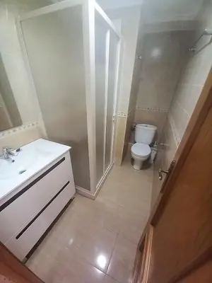 a bathroom with a white sink and a toilet at Sol, 3-20 in Cullera