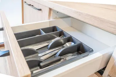 a drawer in a kitchen with utensils in it at Maritim Loft Apartment in Valencia