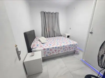 a small bedroom with a bed and a window at AVENIDA DEL CID Alojamiento in Valencia