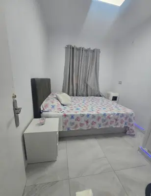 a small bedroom with a bed and a window at AVENIDA DEL CID Alojamiento in Valencia
