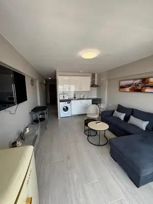 a living room with a couch and a table at apartamento con vistas en la playa de San Antonio in Cullera