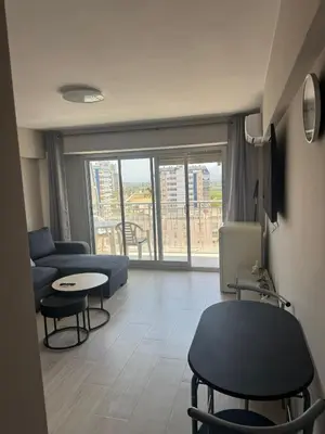 a living room with a couch and a table at apartamento con vistas en la playa de San Antonio in Cullera