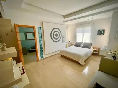 a bedroom with a bed and a target on the wall at luxury home vip valencia in Valencia