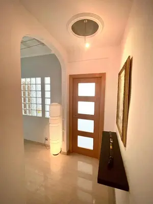 a hallway with a door and a window and a light at luxury home vip valencia in Valencia