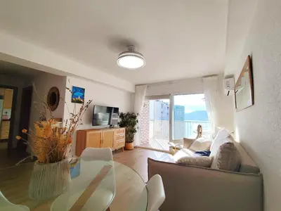 a living room with a couch and a table at Isla de los Pensamientos in Faro de Cullera
