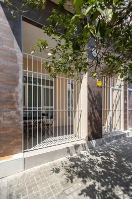 a gate in the side of a building at Benimamet Suite by Concept Flats in Valencia