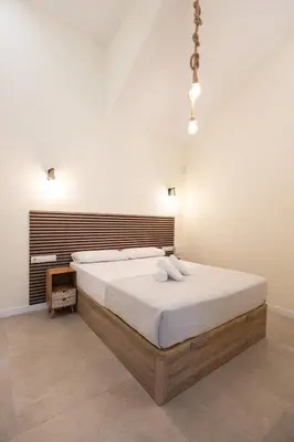 a bedroom with a large bed in a room at Benimamet Suite by Concept Flats in Valencia