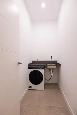 a kitchen with a sink and a microwave at Benimamet Suite by Concept Flats in Valencia