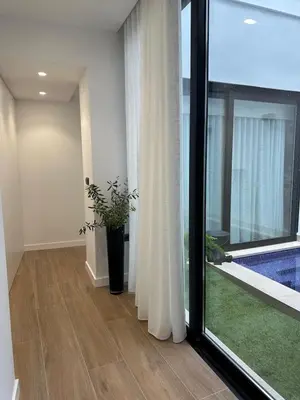 a room with a glass door with a potted plant at Casa Rural con piscina privada en casco urbano de Náquera Botigueta 25 in Náquera