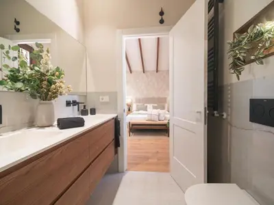 a bathroom with a sink and a toilet at MD Villa Barraques de Lluna in Valencia