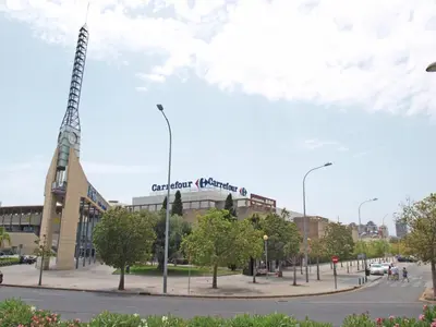 a view of a street with a building with a tower at L'Umbracle Views in Valencia