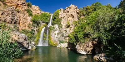 a waterfall in the middle of a body of water at Ca Ona in Chella