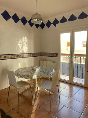 a dining room with a table and chairs at Ca Ona in Chella