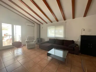 a living room with a couch and a table at Ca Ona in Chella