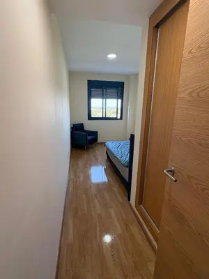 a room with a door and a bed in a room at Seira Apartment in Burriana