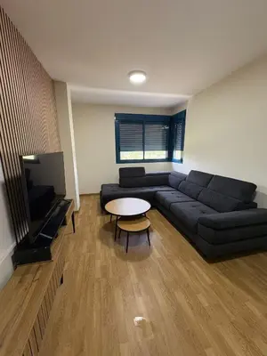 a living room with a couch and a table at Seira Apartment in Burriana