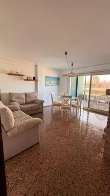a living room with a couch and a table at Apartamento entero Playa Perello Valencia in El Perelló
