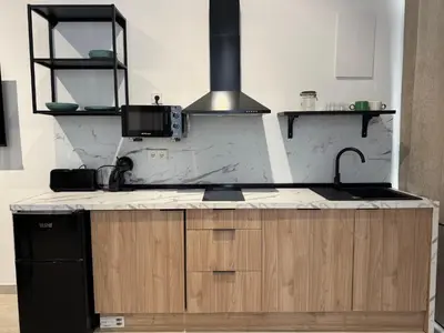a kitchen with a sink and a stove at Apartamento El Rincón de Darío in Valencia