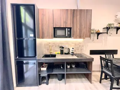 a kitchen with a counter and a refrigerator at Urban Style in Valencia