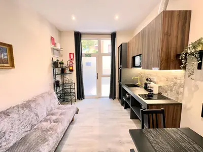 a kitchen with a couch and a sink in a room at Urban Style in Valencia