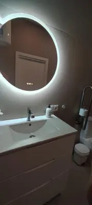 a bathroom with a white sink and a mirror at Basset 1 in Valencia