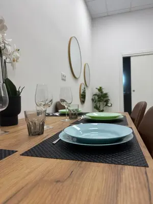 a wooden table with a plate on top of it at Basset 1 in Valencia