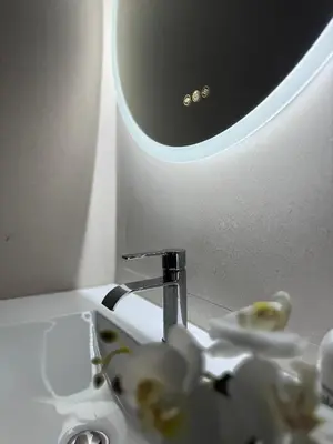 a bathroom sink with a faucet and a mirror at Basset 2 in Valencia