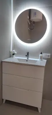 a bathroom with a sink and a large mirror at Basset 2 in Valencia