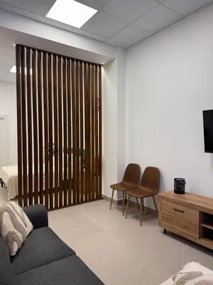 a living room with a couch and chairs and a sliding door at Basset 3 in Valencia