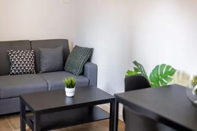 a living room with a couch and two tables at Quiet & Modern Apartment in Valencia