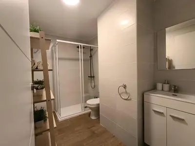a bathroom with a shower and a toilet and a sink at Quiet & Modern Apartment in Valencia