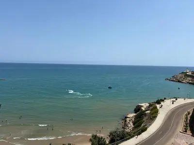 a view of a beach and a road at Faro Cullera Sea view in Faro de Cullera