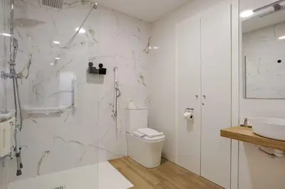 a bathroom with a shower and a toilet and a sink at Bright & Modern Apartment - Rose y Maya in Valencia