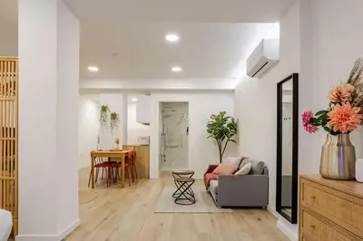 a living room with a couch and a table at Bright & Modern Apartment - Rose y Maya in Valencia