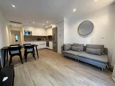 a living room with a couch and a table at Historic Center Apartment in Valencia