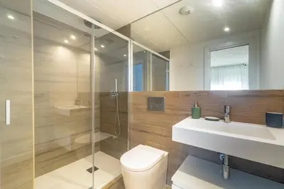 a bathroom with a toilet and a sink and a shower at Historic Center Apartment in Valencia