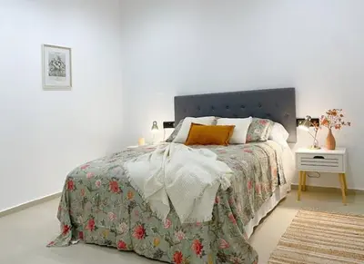 a bedroom with a bed and a nightstand with a bed sidx sidx at Sunny Stay Valencia 4 pax wifi in Valencia