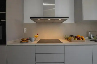 a kitchen with a counter with fruit on it at Dorm4You Calle Gibraltar 15 Ruzafa Apartments in Valencia