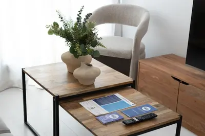 a coffee table with a vase and a plant on it at Dorm4You Calle Gibraltar 15 Ruzafa Apartments in Valencia