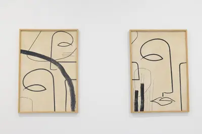two pieces of glass with drawings of people at Dorm4You Calle Gibraltar 15 Ruzafa Apartments in Valencia