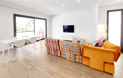 a living room with a yellow couch and a table at Amazing Home In Serra in Serra