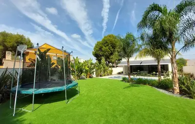 a large yard with a trampoline in the grass at Amazing Home In Serra in Serra