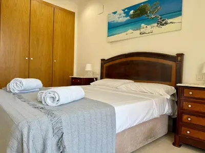 a bedroom with two beds with towels on them at Reinapart Patacona Balcony Seaview in Valencia